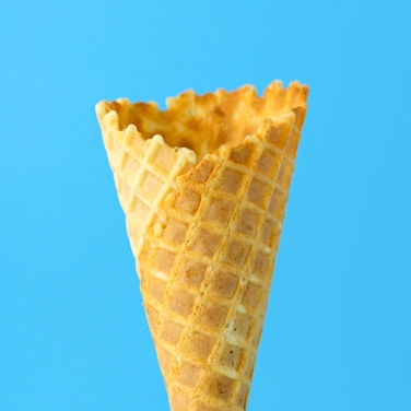 A waffle-style ice cream cone over a blue background