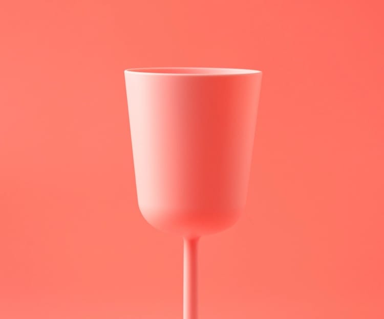 Pink long-stemmed cup over a pink background